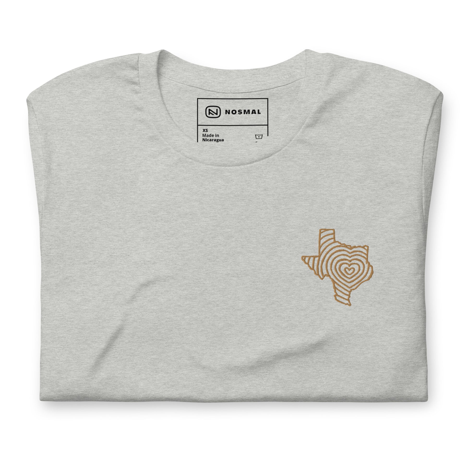 Top down view of heartbeat of texas gold embroidered design on heather athletic grey unisex t-shirt.