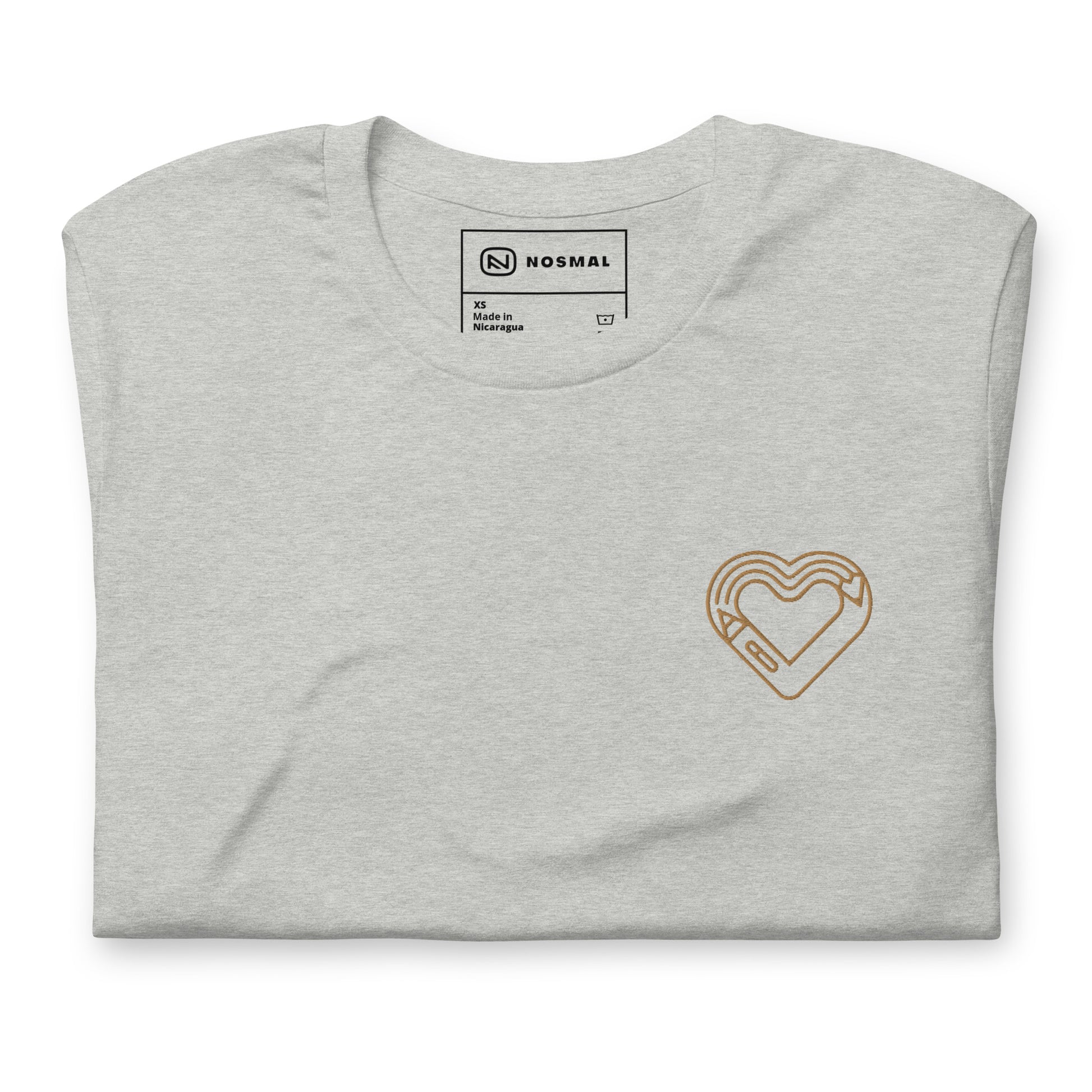 Top down view of maker's heart I gold embroidered design on heather athletic grey unisex t-shirt.