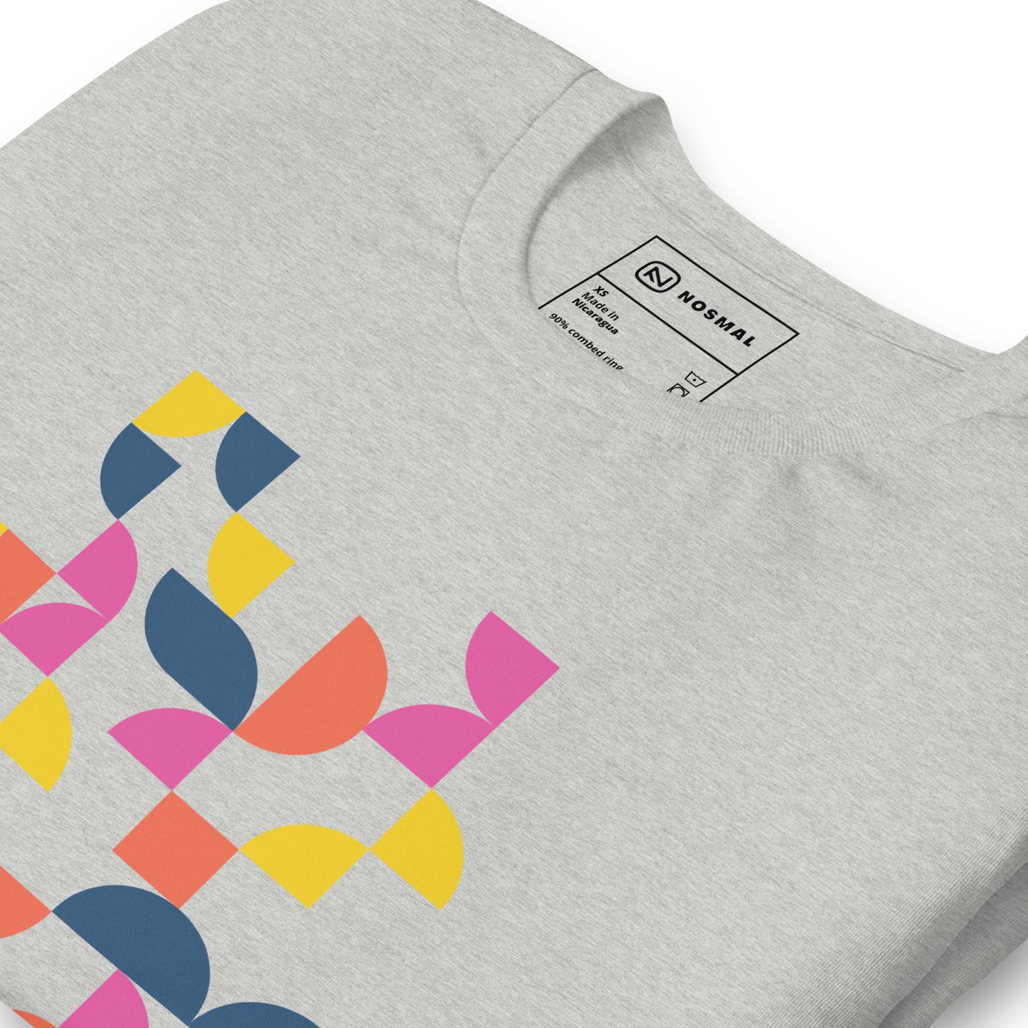 Angled close up shot of geometria I sunrise design on heather athletic unisex t-shirt.
