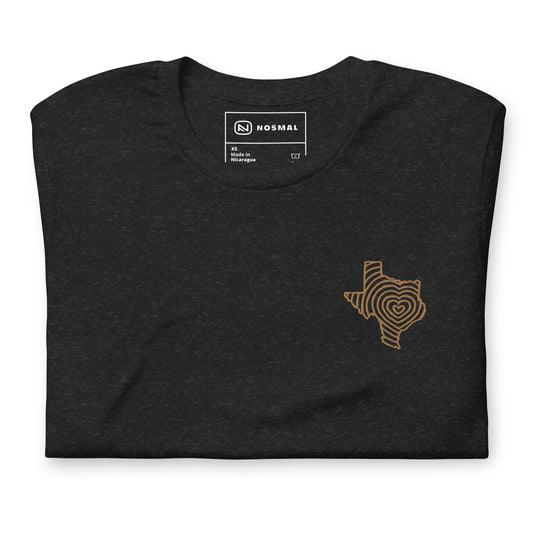 Top down view of heartbeat of texas gold embroidered design on heather black unisex t-shirt.
