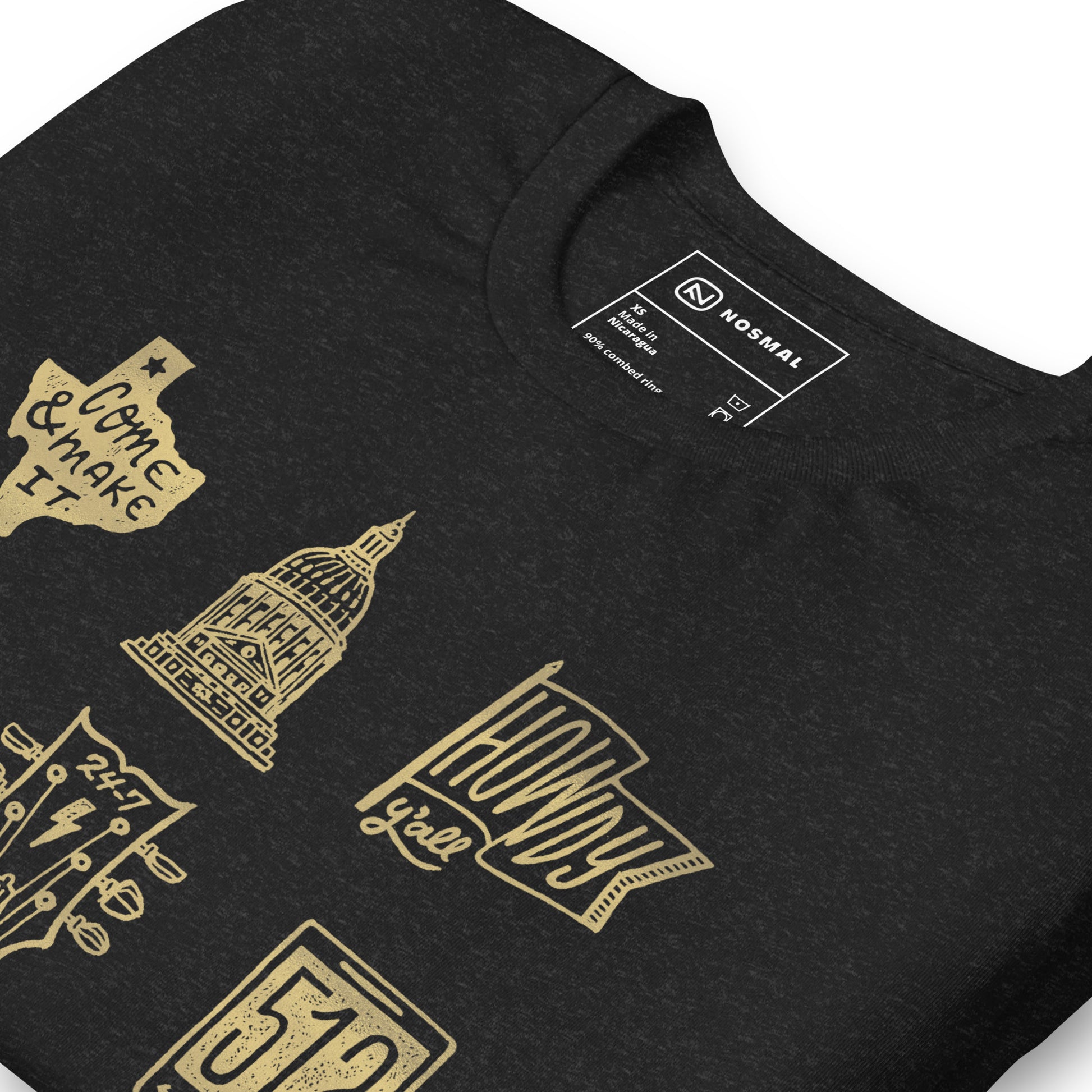 Angled close up shot of ode to 512 gold design on heather black unisex t-shirt.