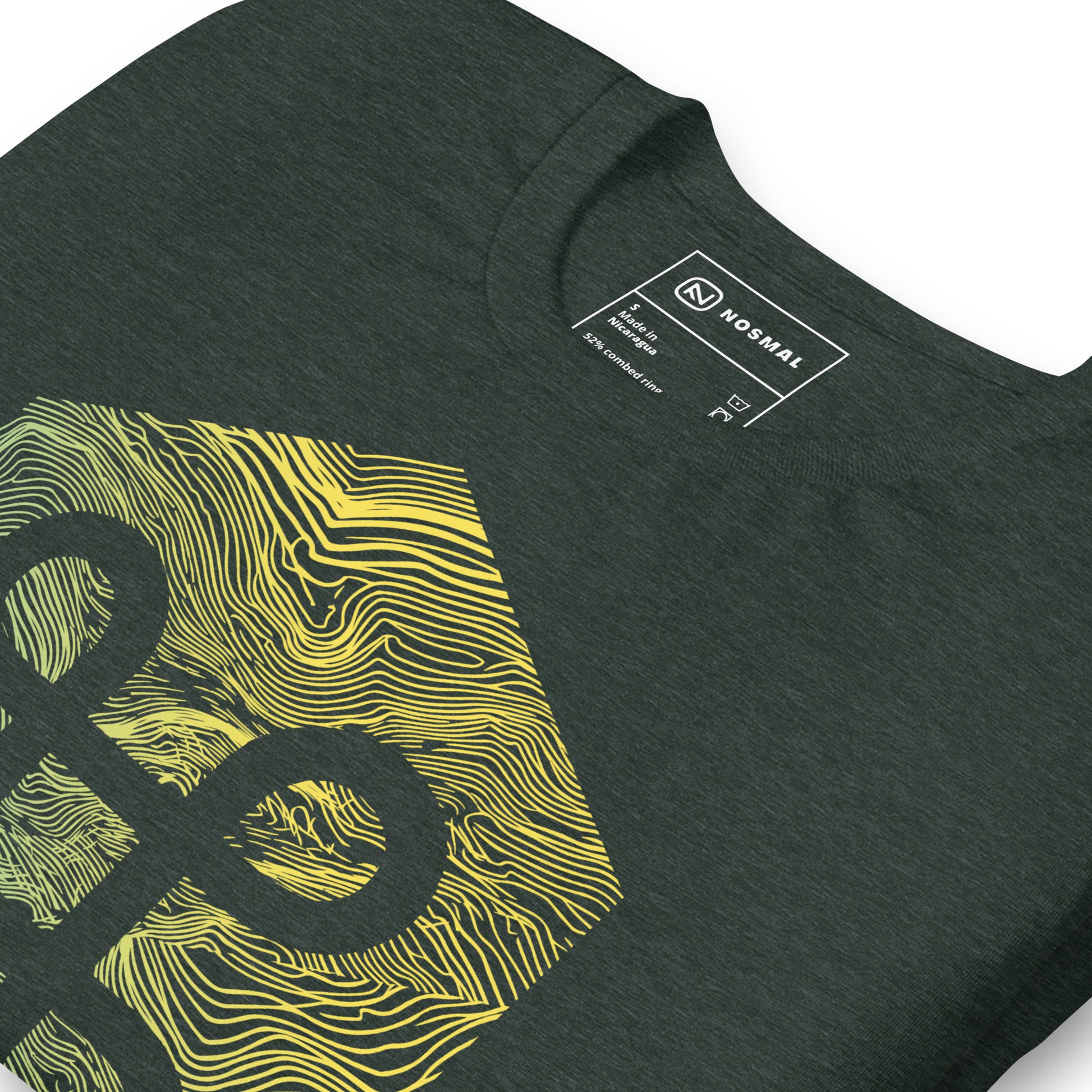 Angled close up shot of the commander gradient design on heather forest unisex t-shirt.
