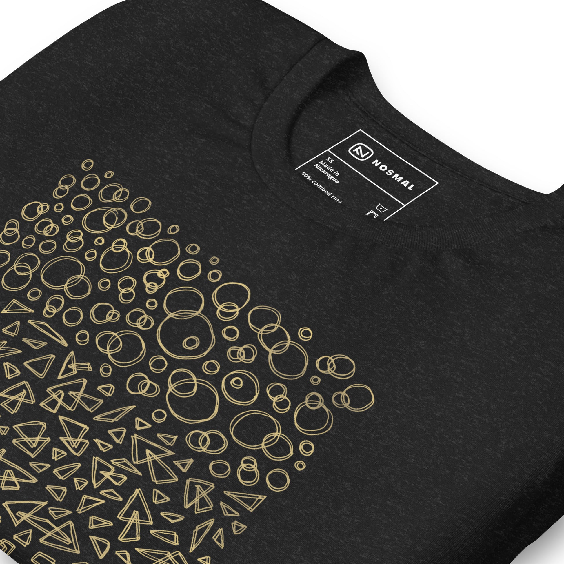 Angled close up shot of geometrinity gold design on heather black unisex t-shirt.