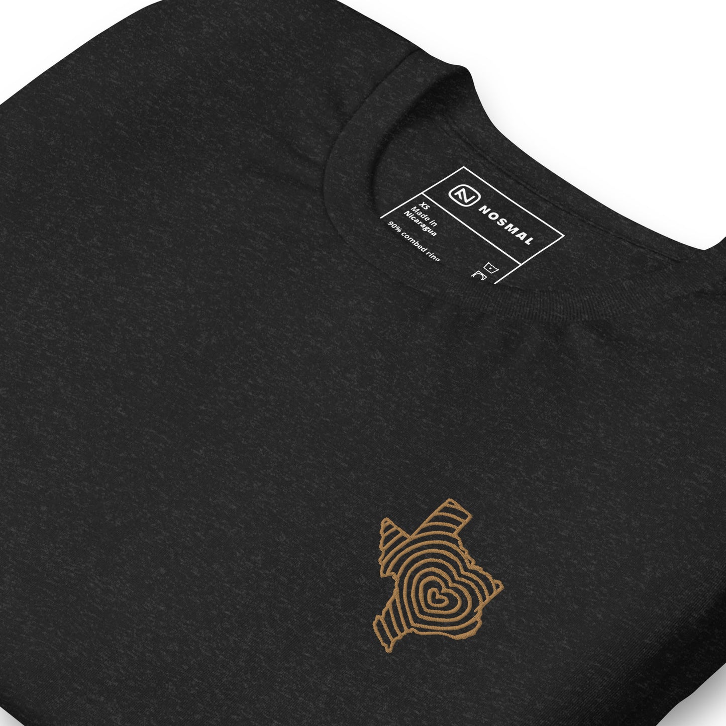 Angled close up shot of heartbeat of texas gold embroidered design on heather black unisex t-shirt.