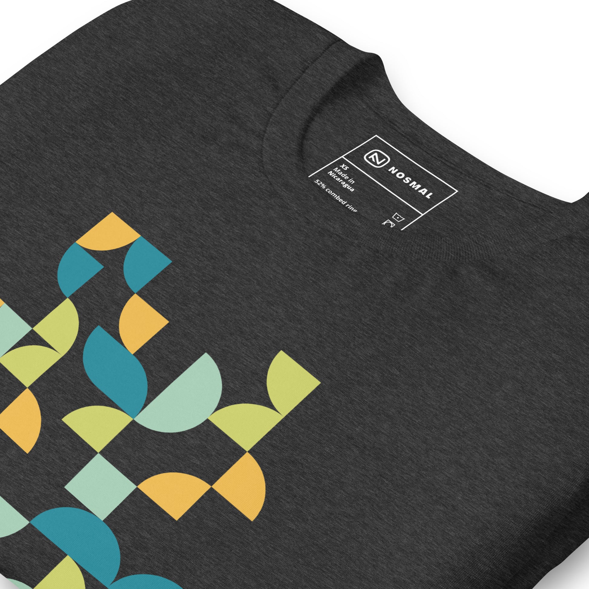 Angled close up shot of geometria I midday design on heather dark grey unisex t-shirt.