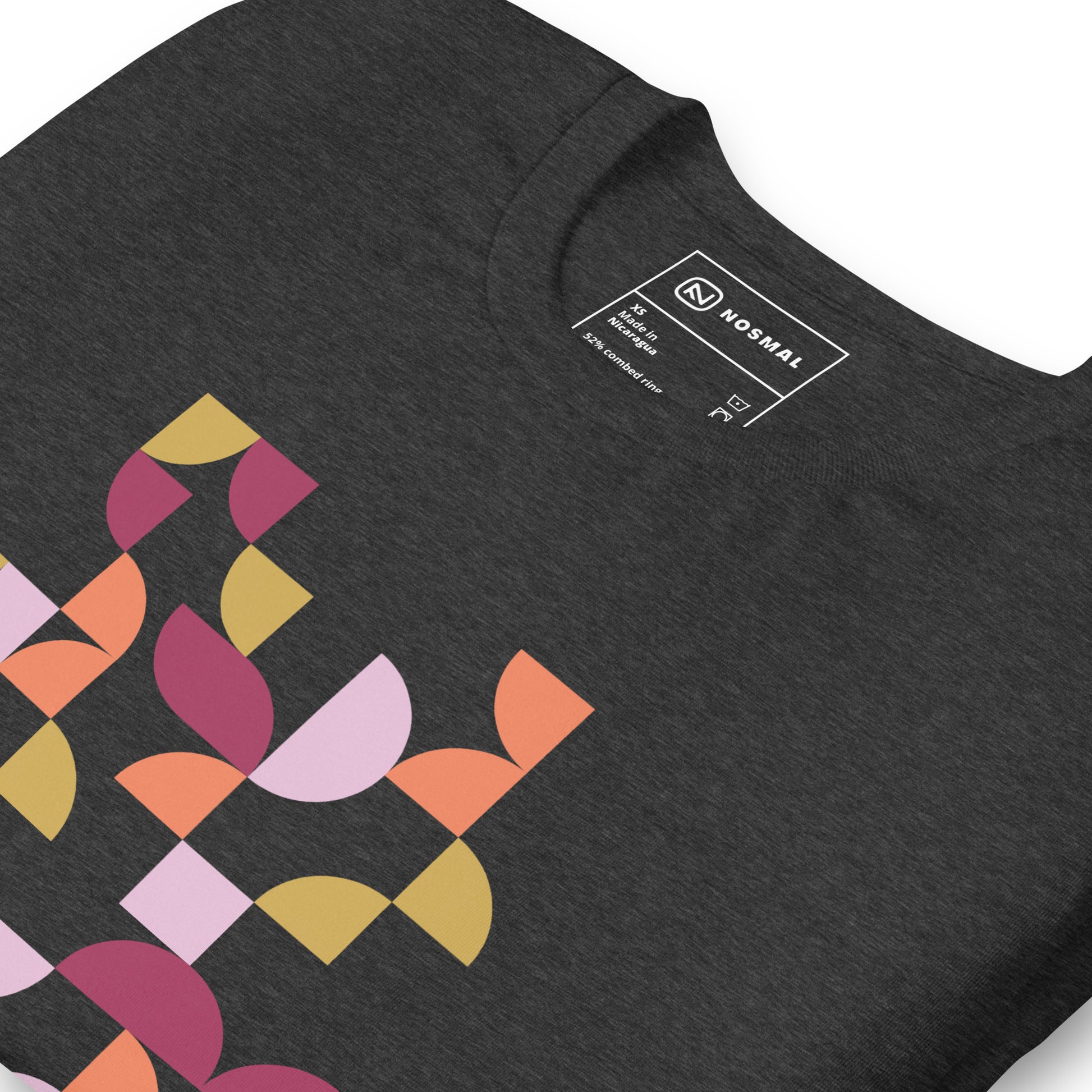 Angled close up shot of geometria I sunset design on heather dark grey unisex t-shirt.