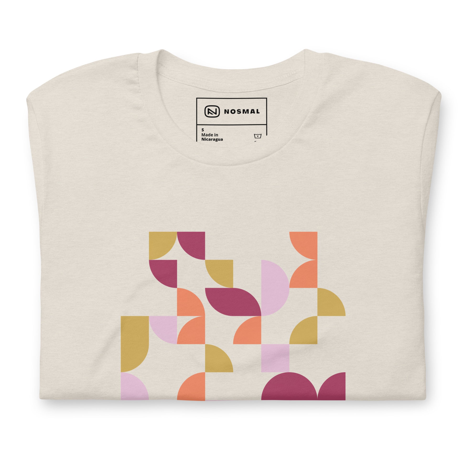 Top down view of geometria I sunset design on heather dust unisex t-shirt.