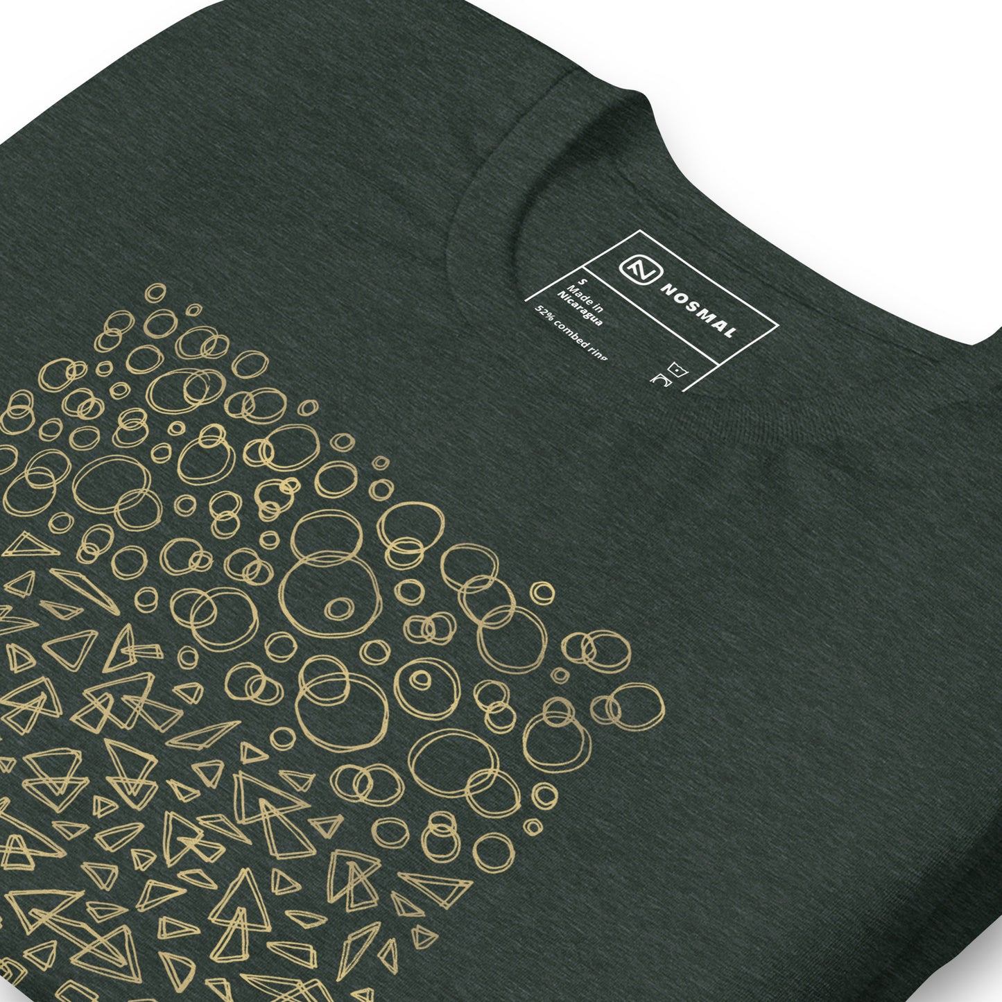 Angled close up shot of geometrinity gold design on heather forest unisex t-shirt.