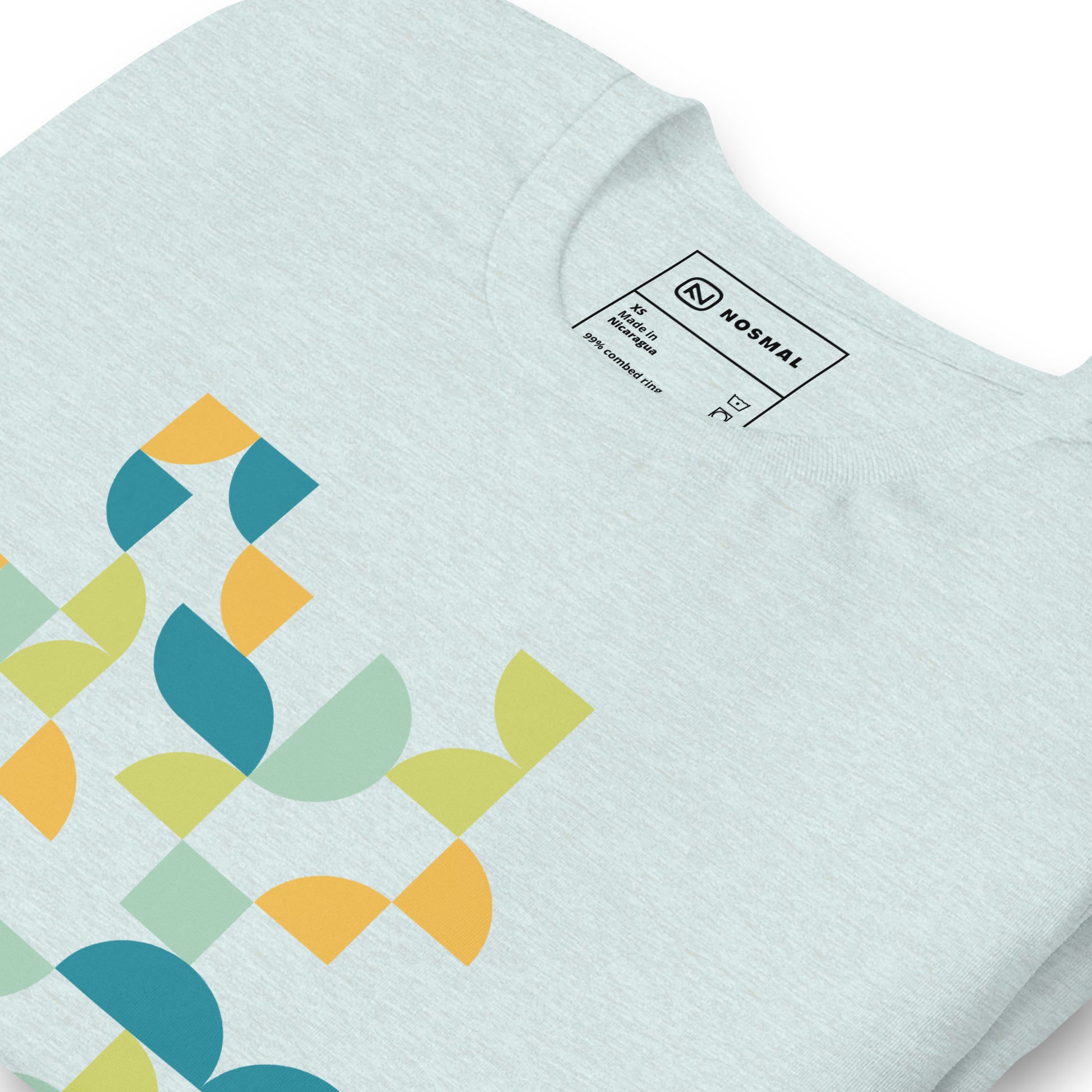 Angled close up shot of geometria I midday design on heather prism ice clue unisex t-shirt.