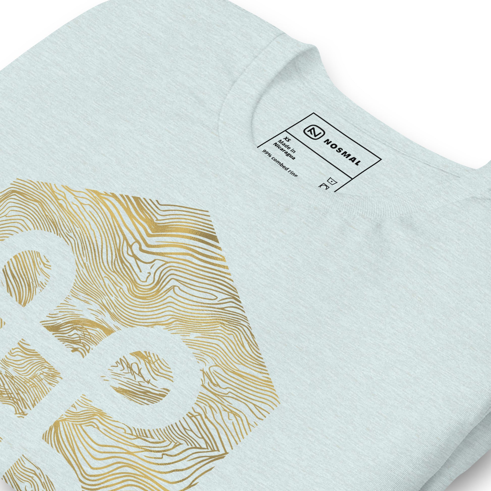 Angled close up shot of the commander gold design on heather prism ice blue unisex t-shirt.
