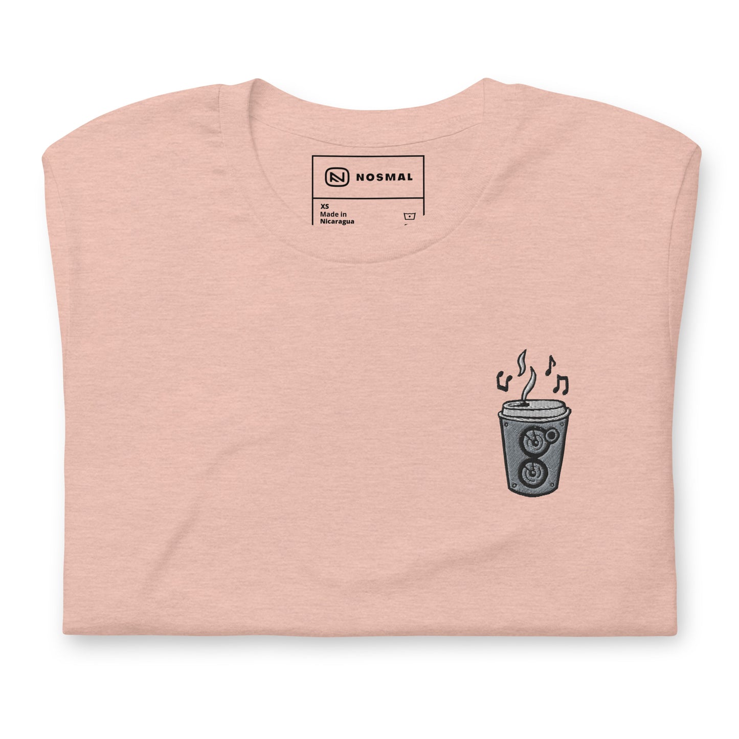 Top down view of the coffee is my jam embroidered design on heather prism peach unisex t-shirt.