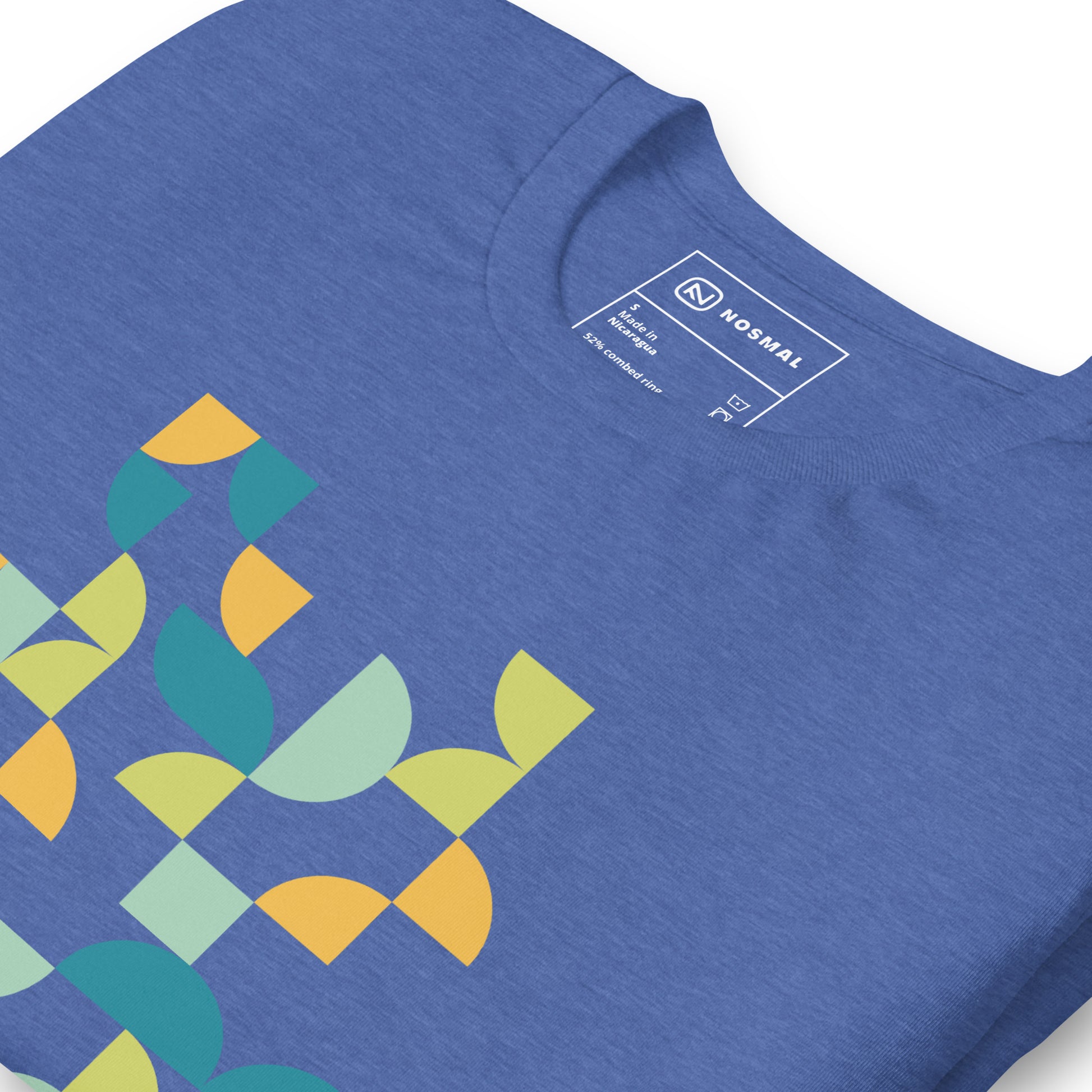 Angled close up shot of geometria I midday design on heather true royal unisex t-shirt.