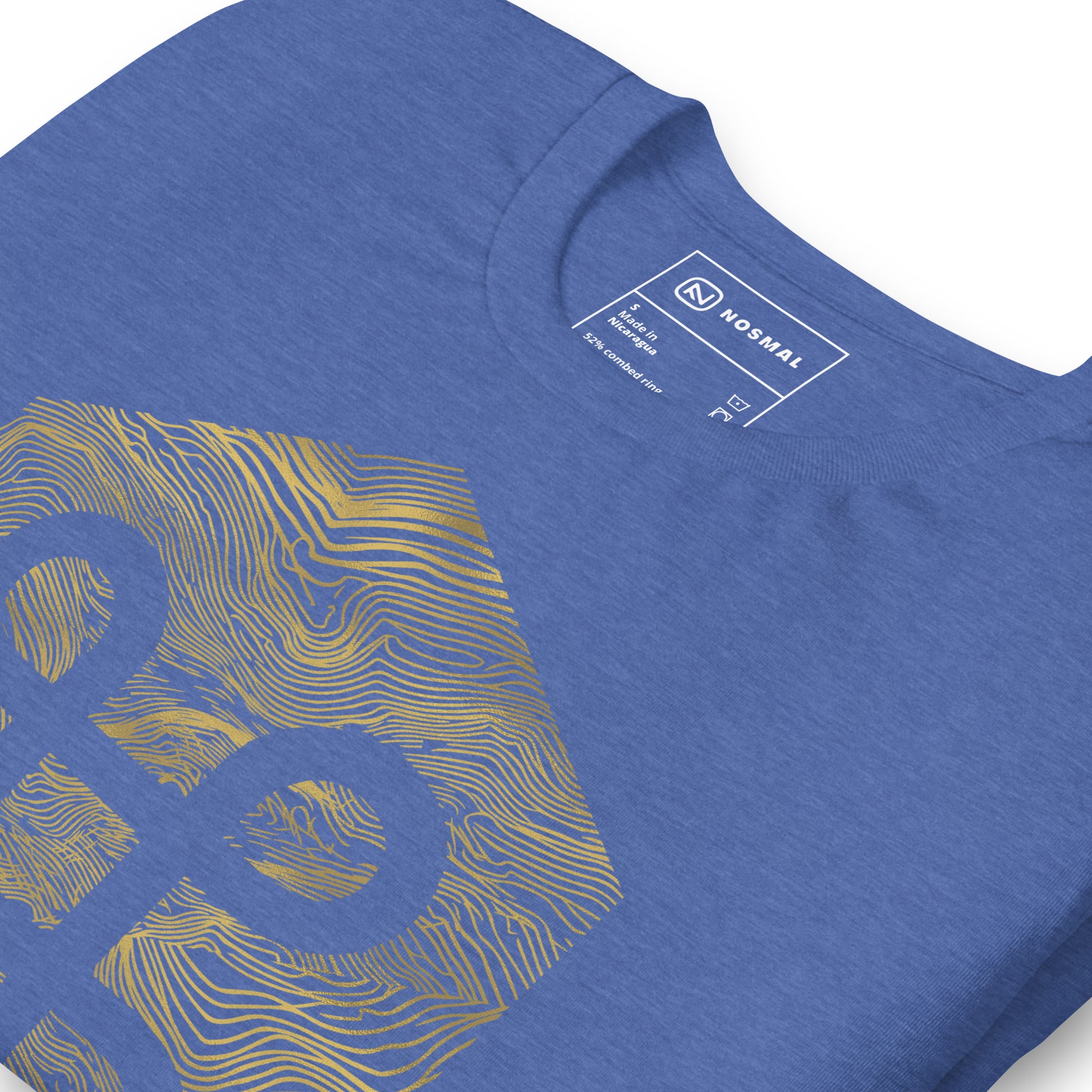 Angled close up shot of the commander gold design on heather true royal unisex t-shirt.