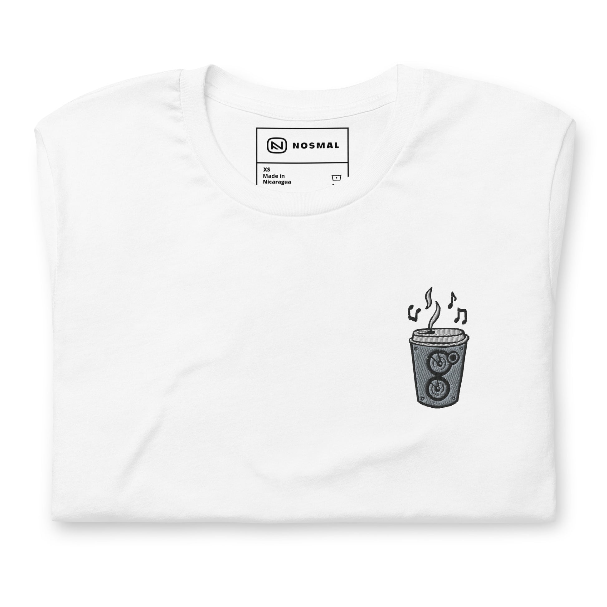 Top down view of the coffee is my jam embroidered design on white unisex t-shirt.