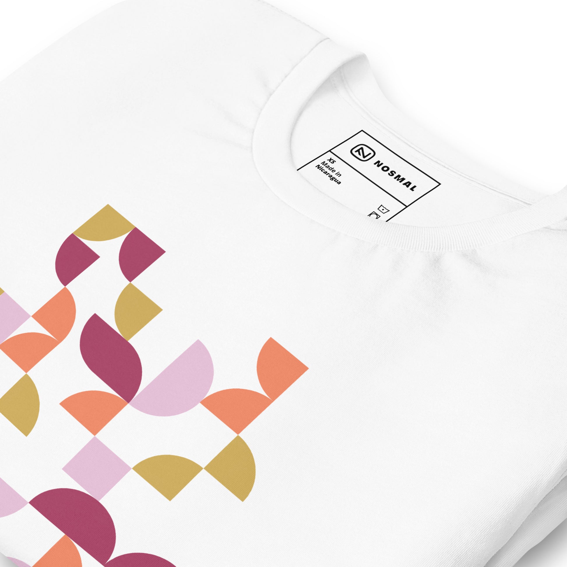 Angled close up shot of geometria I sunset design on white unisex t-shirt.